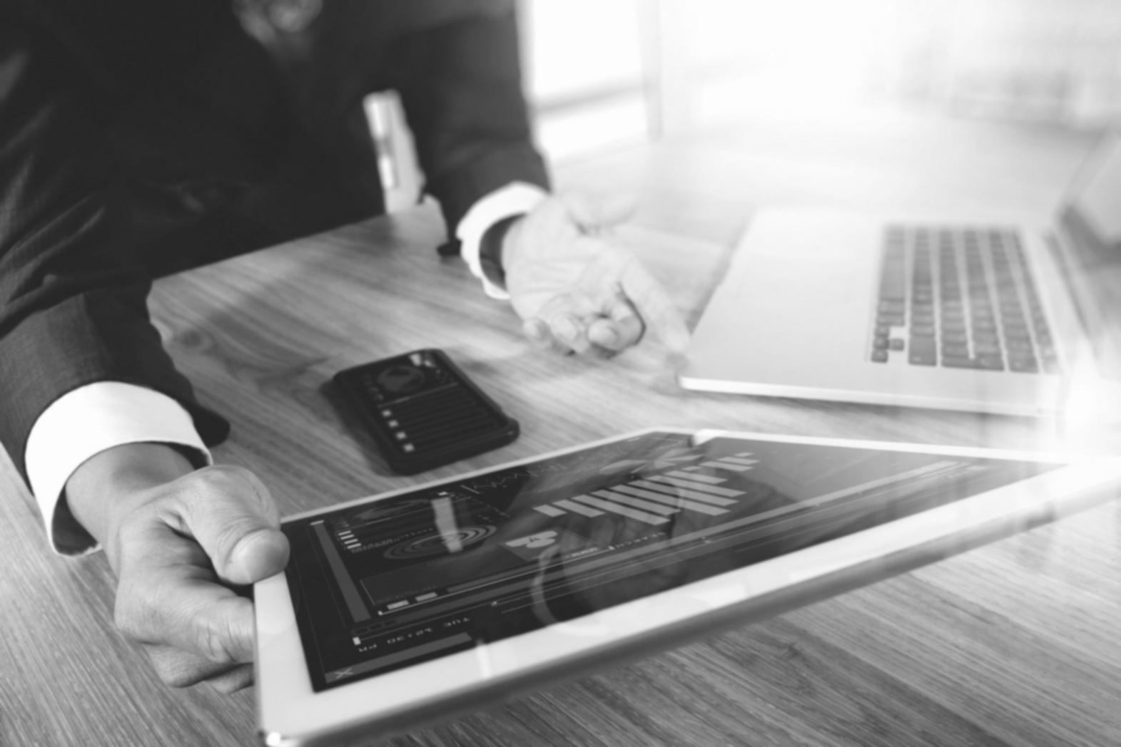 Close-up view of financial analysis with graphs and calculator on desk